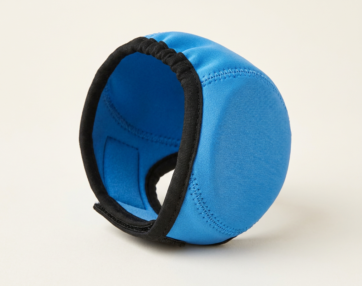 Blue noise-reducing dog ear defenders, studio photo